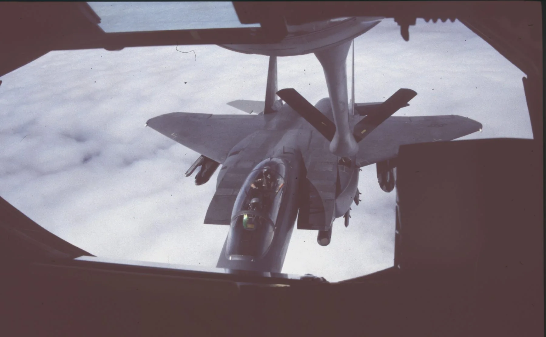 F-15 Eagle in close formation with a KC-135 Stratotanker over the North Sea during mid-air refuelling — photograph taken by Wayne Davis from the tanker at 18,000 feet